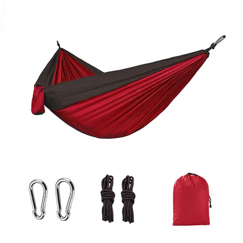 Hamac camping facile à installer à suspendre rouge, livré avec accessoires pour une suspension rapide entre deux arbres ou supports adaptés